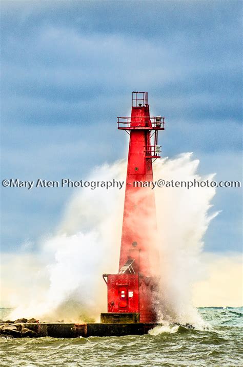 Photo of Muskegon lighthouse with wave spray circling lighthouse