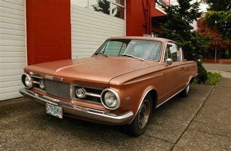 OLD PARKED CARS.: 1964 Plymouth Barracuda.