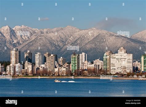 Vancouver skyline: The snow capped North Shore Mountains form a ...