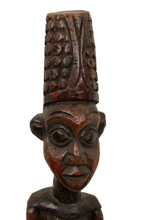 African sculpture of a figure standing on a leopard