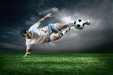 Soccer Action in Rain Wall Mural: Sports: Soccer: This action shot mural of a soccer player ...