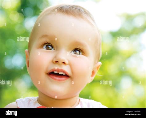 Little Baby Girl Portrait outdoor. Child over nature background Stock Photo - Alamy