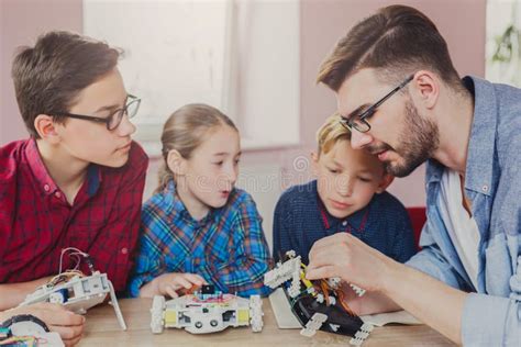 Stem Education. Kids Creating Robots with Teacher Stock Photo - Image of child, build: 101412830