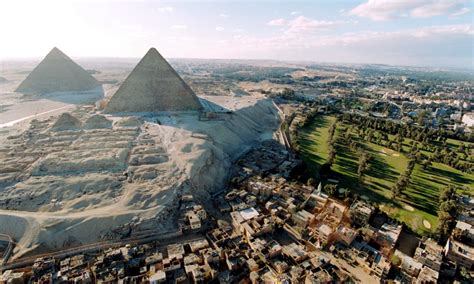 The 4500 year old Great Pyramids of Giza in the backdrop of the slums of Cairo, Egypt - AR15.COM