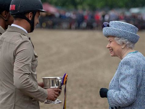 In Pictures: Queen wraps up warm to enjoy a day at Royal Windsor Horse ...