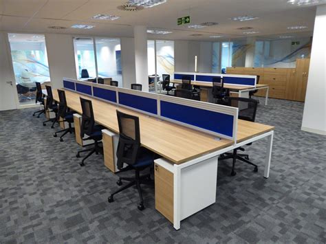 New open plan office space with blue desk dividers separating the ...
