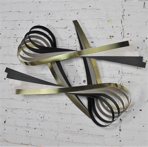 Vintage C. Jere Ribbon Wall Sculpture in Brass-Tone, Silver and Black Painted Metal – warehouse 414