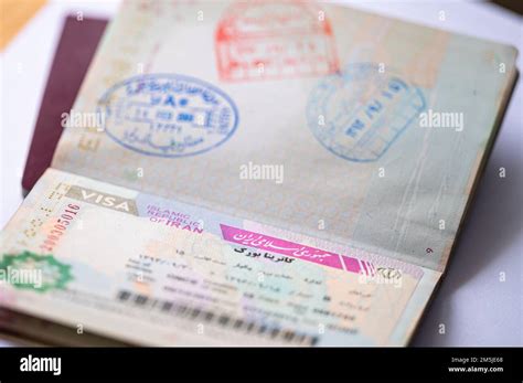 Close-up of a passport with an Iranian visa Stock Photo - Alamy