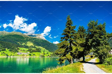 Road at lake reschen in italian alps containing italy, reschensee, and travel | Nature Stock ...