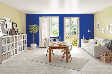 a living room with blue and yellow walls