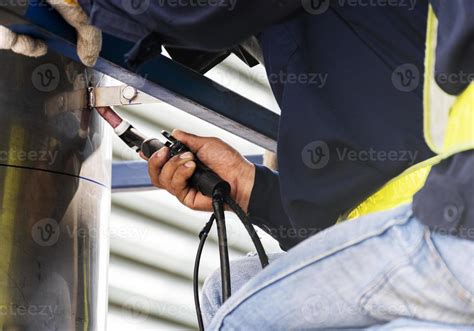 Close up hand welder gas pipe repair welding in industrial plant. 14389470 Stock Photo at Vecteezy