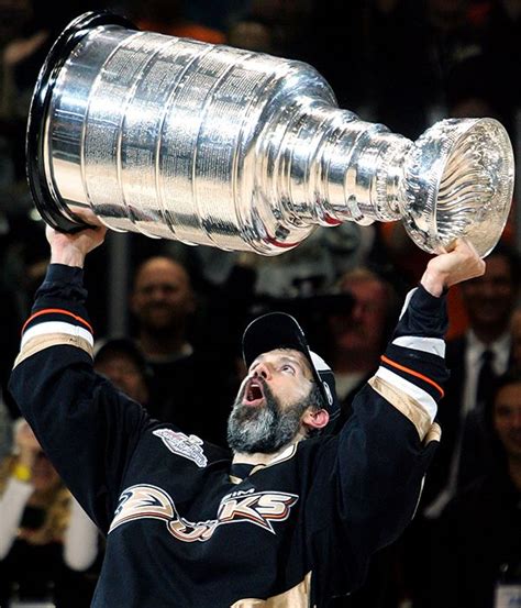 Captain Scott Niedermayer of the Anaheim Ducks hoists the Stanley Cup after his team's victory ...