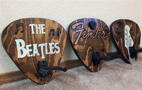 DIY Guitar Hanger: Create a custom pick-shaped hanger | Guitar wall hanger, Guitar hanger ...