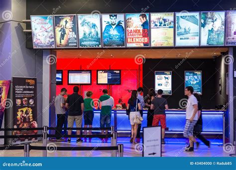 People Buying Tickets At The Cinema Editorial Image - Image: 43404000