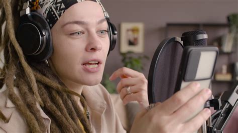 Free stock video - Close up view of woman with dreadlocks recording a podcast wearing headphones ...