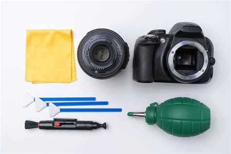 Premium Photo | Camera sensor and lens cleaning tools with dslr camera ...