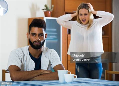 Blonde Girl Yelling At Black Boyfriend As Quarreling Indoors Stock Photo - Download Image Now ...