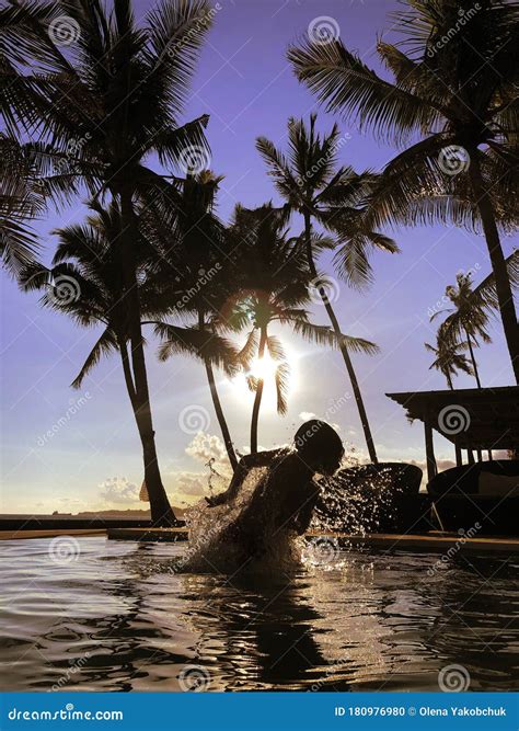 Silhouette of Child Swimming in the Pool during Sunrise Stock Photo ...