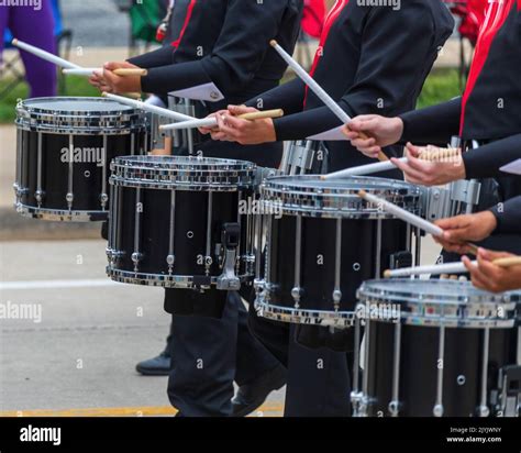 bass section of a marching band drum line warming up for a parade Stock ...