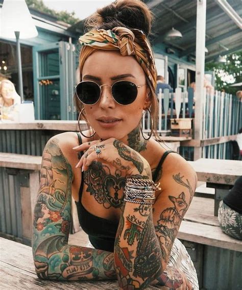 woman with sunglasses, coloured tattoos, on both hands, arm tattoo ideas, silver bracelets ...