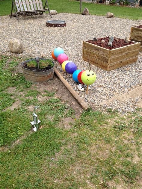 Caterpillar I made from bowling balls | Bowling ball yard art, Glassware garden art, Garden design