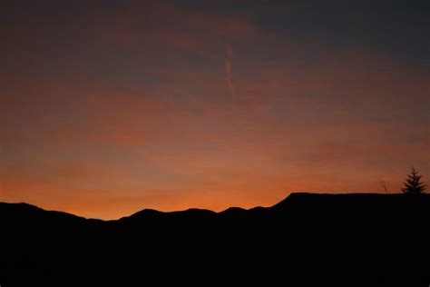 Silhouette of Mountain Range during Sunset · Free Stock Photo