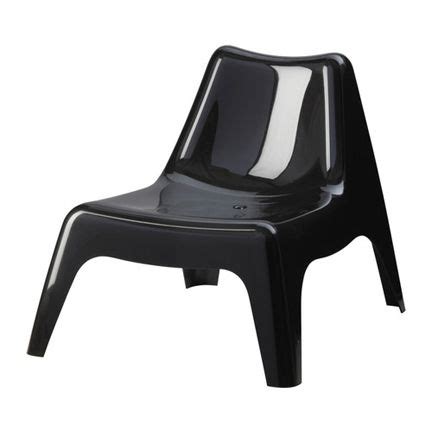 a black plastic chair with white stripes on it