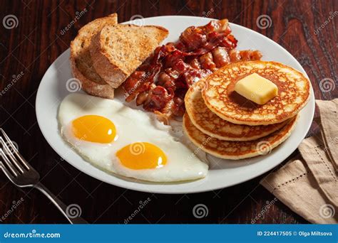 Traditional Full American Breakfast Eggs Pancakes with Bacon and Toast Stock Image - Image of ...