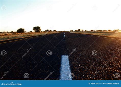 TARRED ROAD at SUNSET stock image. Image of countryside - 96462567