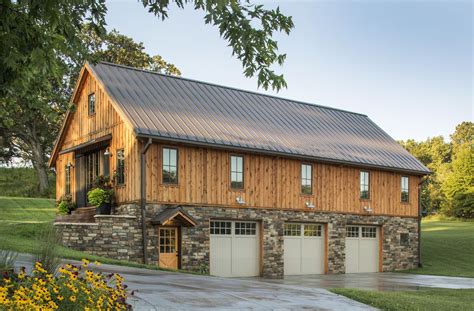 Barn Home with stone around the 3 car garage. Sand Creek Post & Beam ...