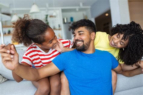 Premium Photo | Attractive happy family hugging attractive mother ...