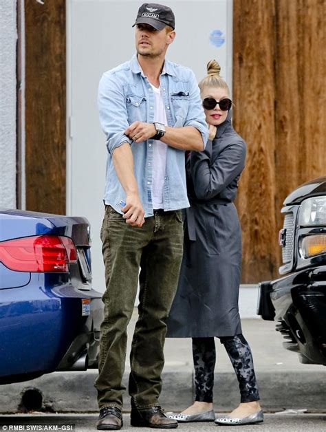 Fergie goes for a bang on trend high bun as she runs errands with ...