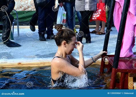 Young Woman Making the Sign of the Cross before Plunging into the Icy ...