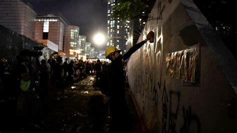 Hong Kong protesters throw Chinese flag into harbour | World News | Sky News