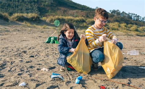 Children volunteers cleaning the beach stock photo (192561 ...