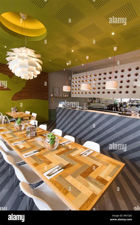 Modern Restaurant interior long table Stock Photo - Alamy