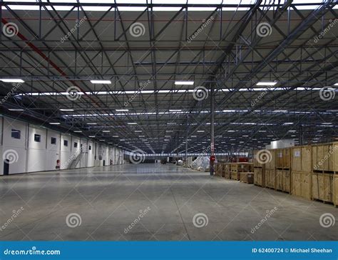 Modern warehouse interior stock photo. Image of lighting - 62400724