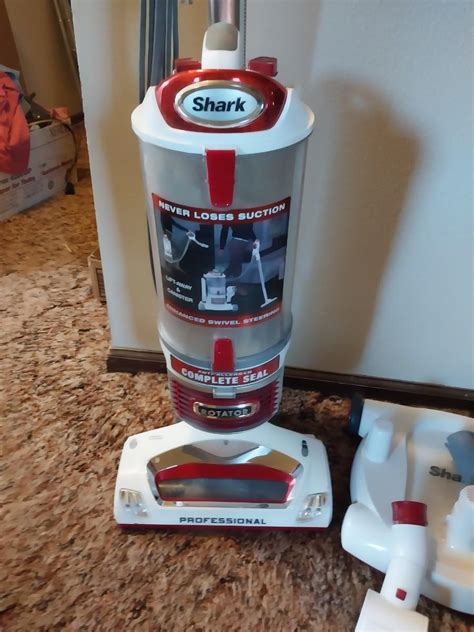 LIKE NEW SHARK ROTATOR VACUUM WITH ATTACHMENTS | EstateSales.org