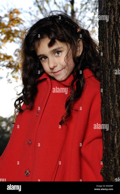 Girl in red coat Stock Photo - Alamy