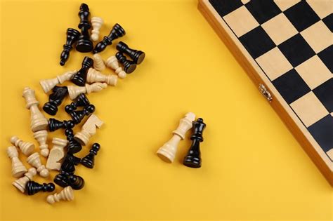 Premium Photo | Two figures on the background of chess on the table