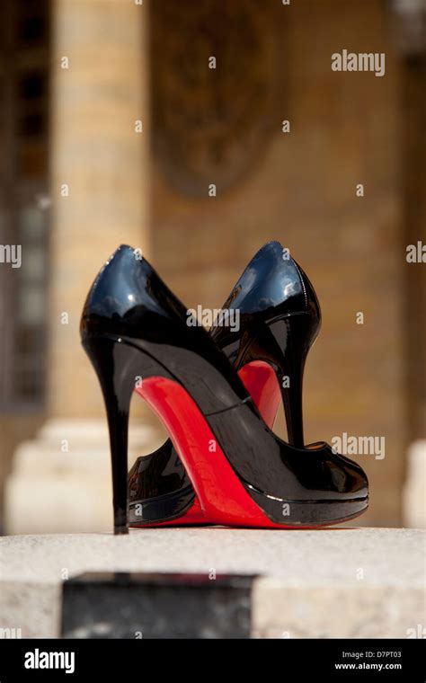 Pair of Christian Louboutin high heels in the courtyard of Palais Royal ...