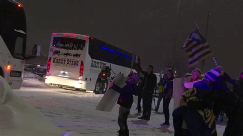 Fans line Bozeman streets and brave cold temps to cheer on MSU Football team as they head to Frisco