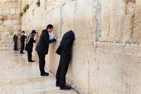 Photograph praying at the Western Wall in Jerusalem by Pini Hamou on 500px