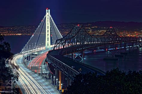 Photograph The New and Old Bay Bridge at Night by Aaron Zhong on 500px