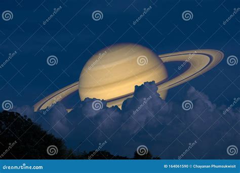 Saturn on Night Sky Back Silhouette Mountain and Heap Cloud Stock Photo ...