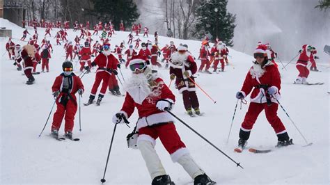 It's All Downhill for 300 Skiing Santas, a Grinch and a Tree