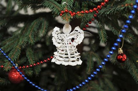 Premium Photo | Knitted angel as a christmas tree decoration