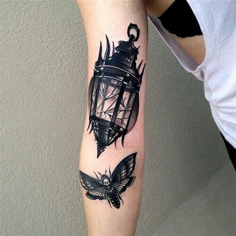 Moth to a flame | Butterfly tattoos on arm, Lantern tattoo, Tattoos