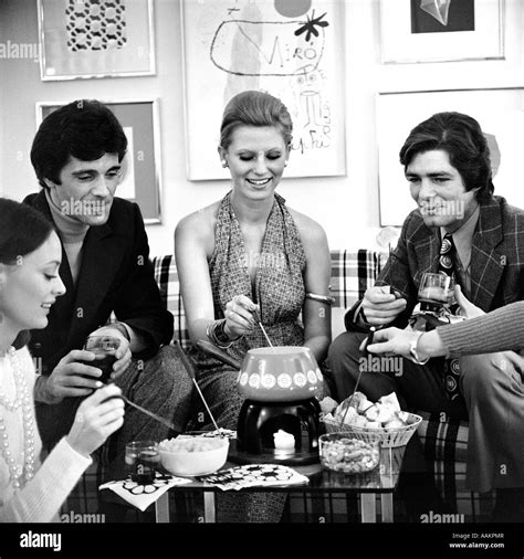 1970s FONDUE PARTY WITH SEVERAL COUPLES Stock Photo - Alamy