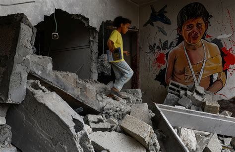 Gaza graffiti artists bedeck houses destroyed by Israel in war | Reuters